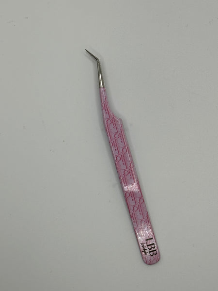 Dior pink tweezers