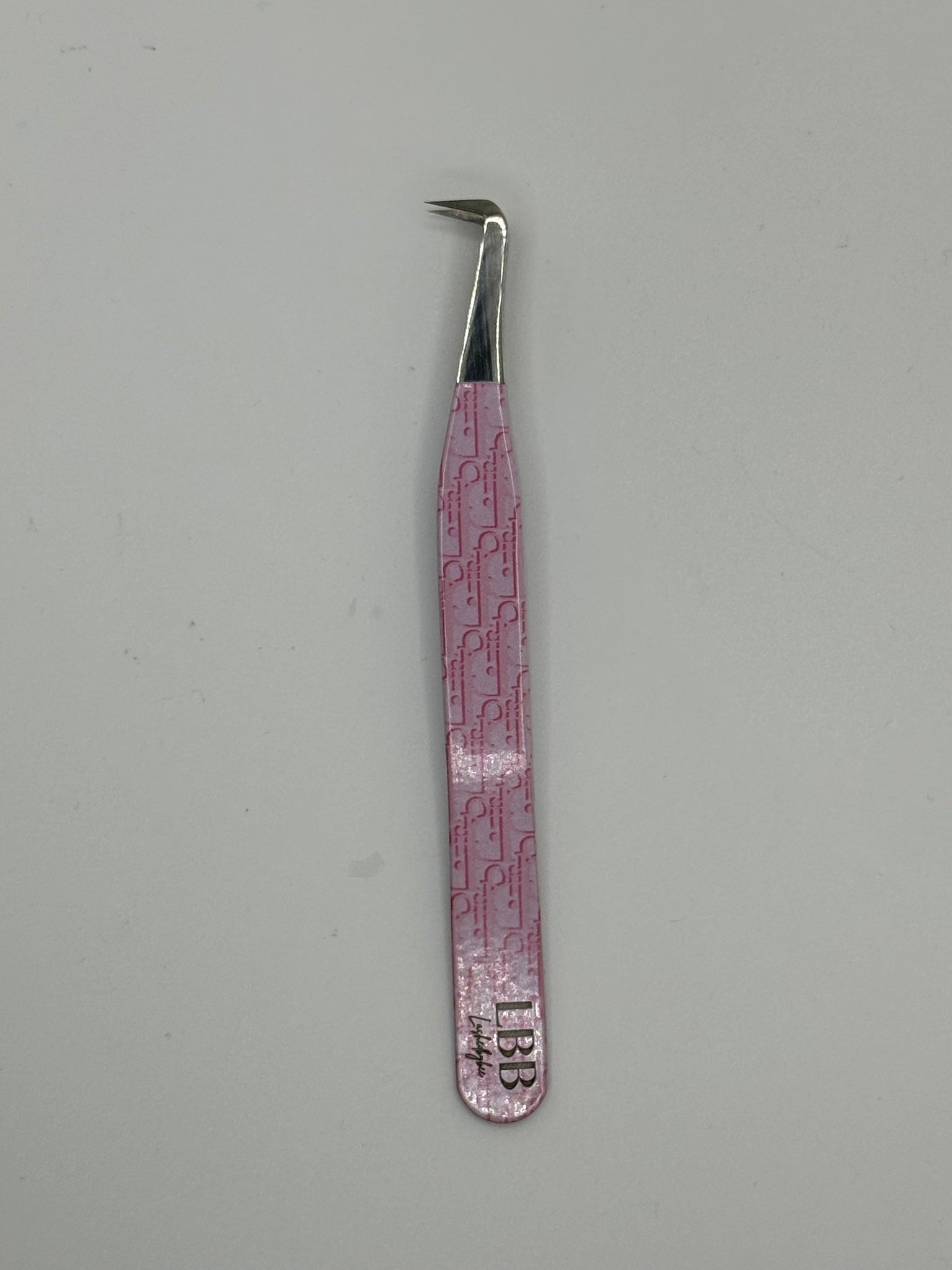 Dior pink tweezers
