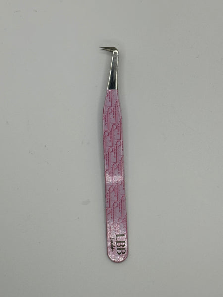 Dior pink tweezers