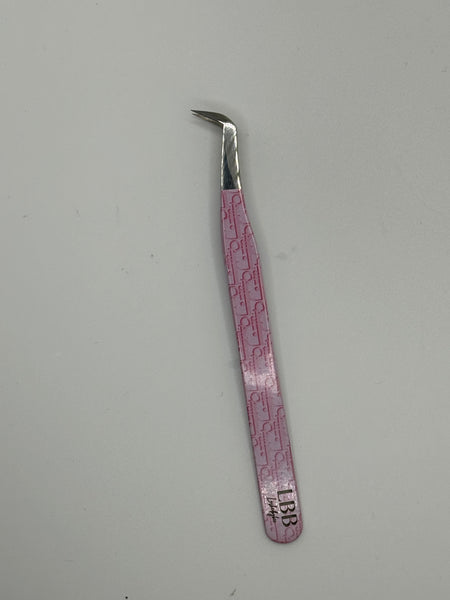 Dior pink tweezers