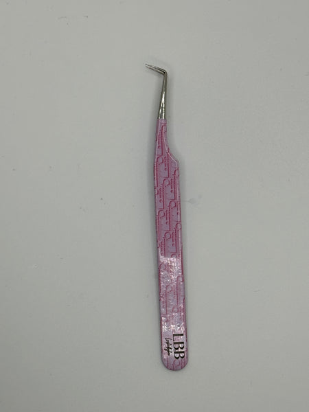 Dior pink tweezers